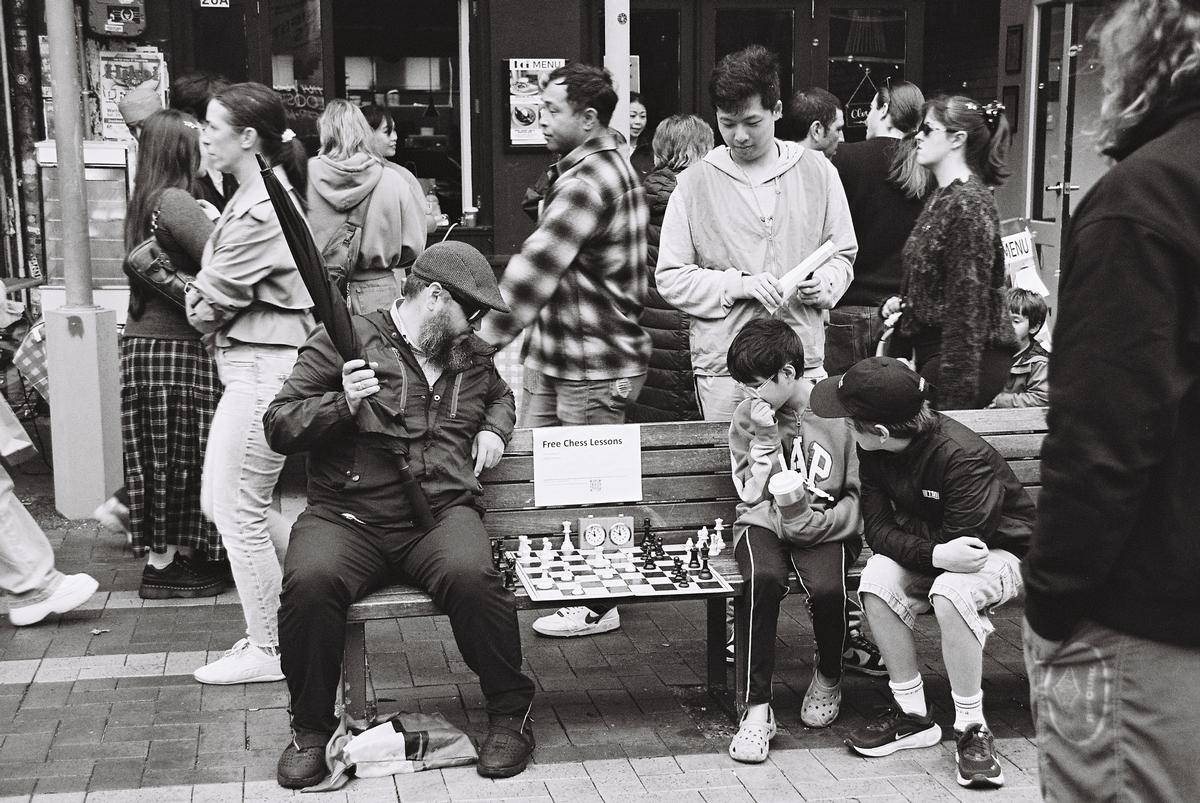 Liam Scrivener; Advantage; Man plays chess with two boys, Wellington (2026)