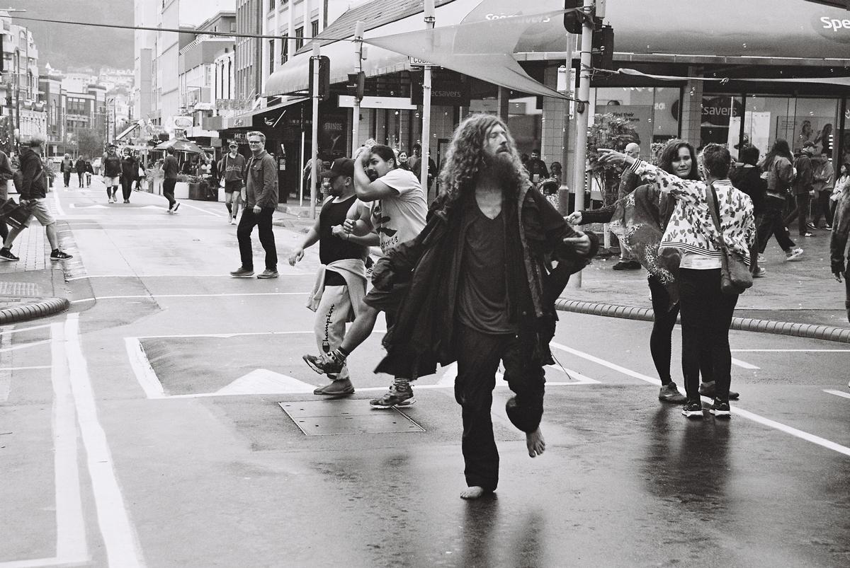 Liam Scrivener; Happy Again; Man dances in the rain, Cuba Street (2026)
