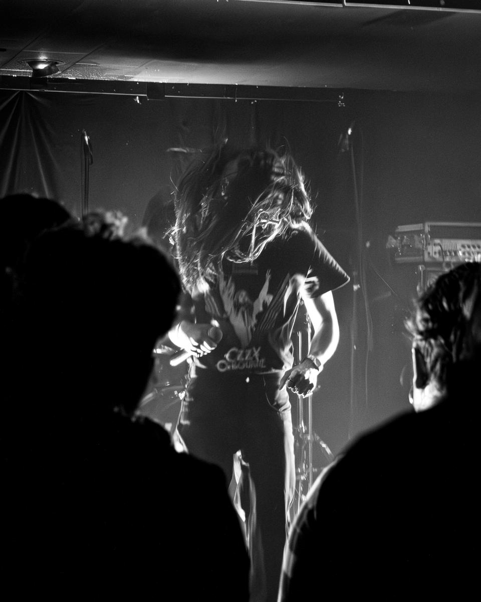 Bayley McKeown; Ritual of Sound; An atmospheric monochrome image that uses motion, contrast, and crowd perspective to capture the chaos and emotion of live performance.