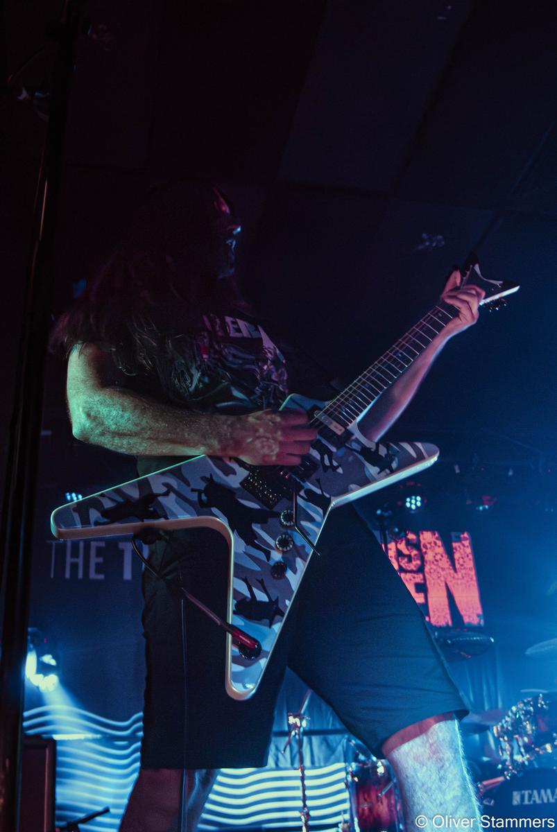 Oliver Stammers;Straight up roaring frequency.;Close up low angle shot of the guitarist doing a Pantera tribute concert from the aussie band By Demons Be Driven shredding on his guitar, a wild experience.