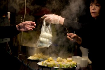 Hongcan Chen;Handing Out The Steamed Stuffed Bun